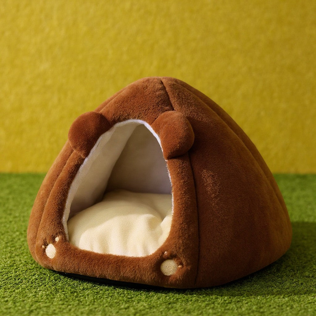 Animoo brown plush pet bed shaped like a bear head with ears and paw prints, offering a cozy, enclosed space.