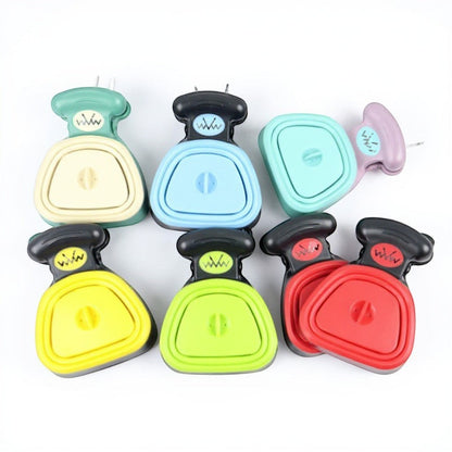 Animoo portable dog waste scooper in various colors: cream, blue, purple, yellow, green, and red. Features a one-handed ergonomic design.