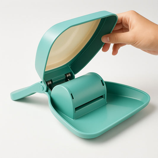 Animoo teal and cream plastic one-handed dog waste scooper with integrated bag dispenser.
