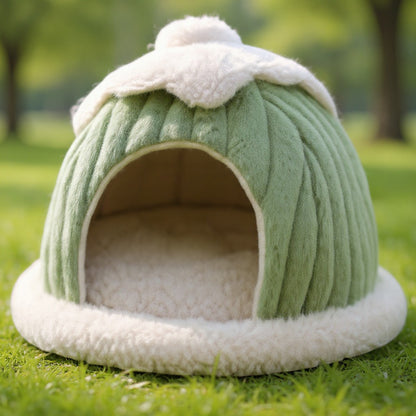 Animoo light green plush pet bed shaped like a cozy dome with white trim. Offers a warm, enclosed space for cats and small dogs.