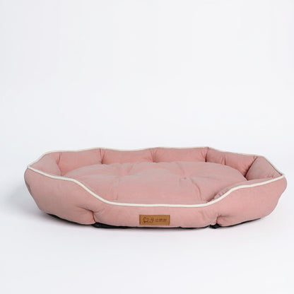 Animoo pink plush dog bed with raised sides and soft sudedine fabric for ultimate comfort and security.
