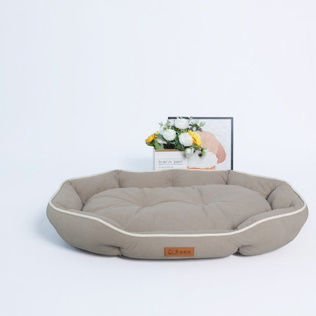 Animoo taupe suede effect dog bed with raised sides for a cozy feel. Plush filling for ultimate comfort.