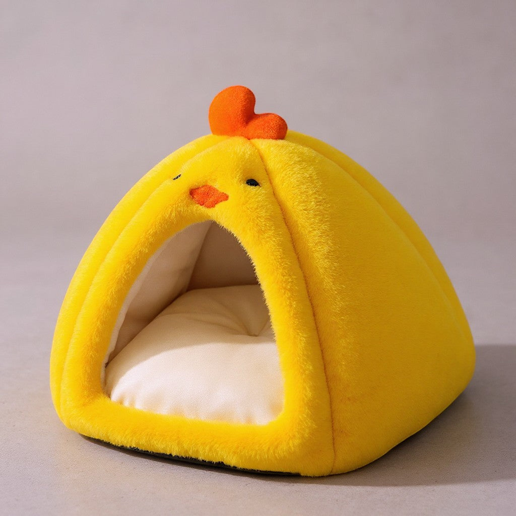 Animoo yellow plush chick-shaped pet bed with orange beak and comb, soft and cozy for cats and small dogs.